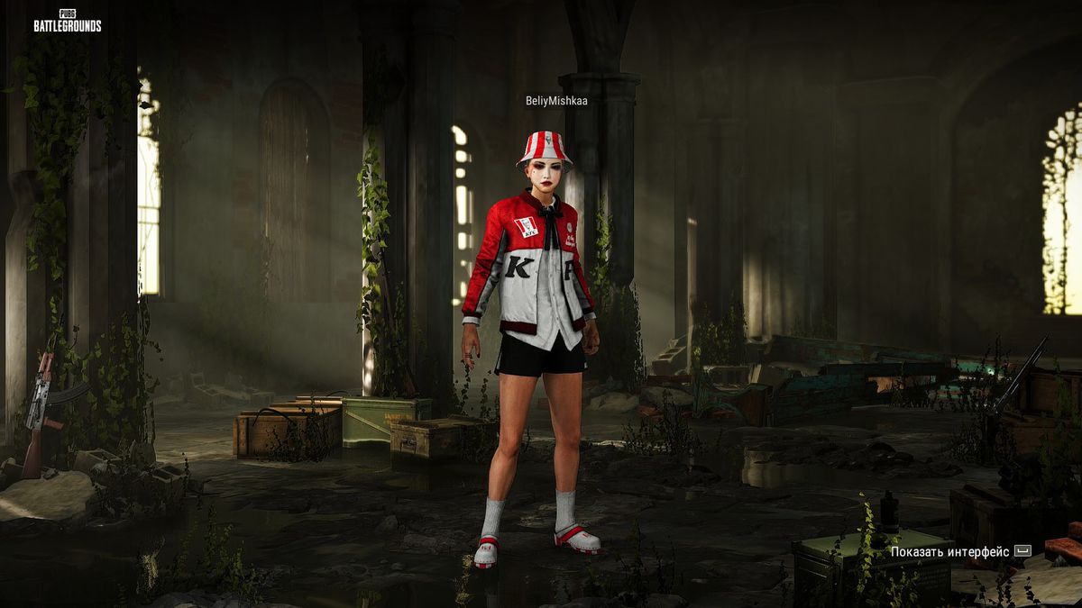 A PUBG: Battlegrounds character stands in a derelict chapel wearing a KFC-branded jacket and hat