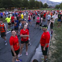 Runners make their way to the start of the Deseret News 10K race in Research Park. The race finished at Liberty Park in Salt Lake City on Tuesday, July 24, 2018.