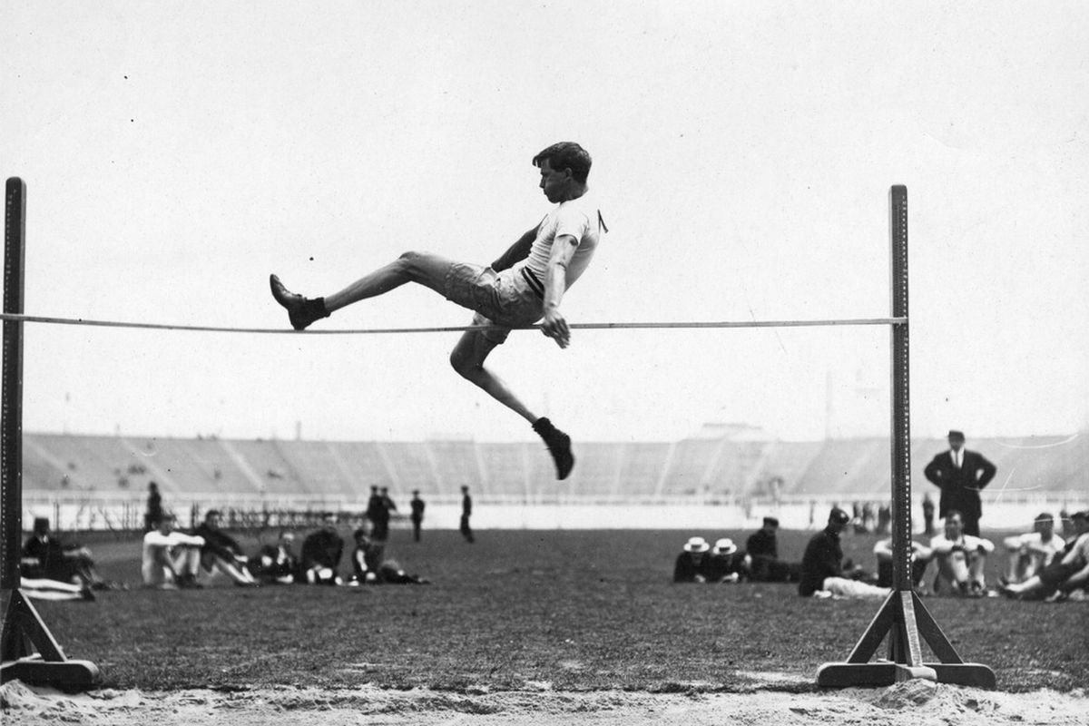 This week in really old photos: either high jumping, or really terrible tightrope walking.  (Photo by Topical Press Agency/Getty Images)