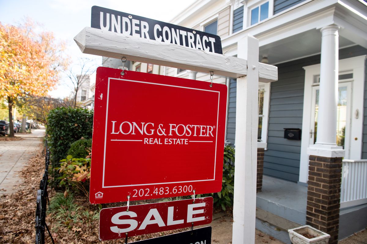 A house’s real estate for sale sign shows the home as being “Under Contract” in Washington, DC, November 19, 2020.