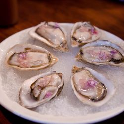 Oysters from Momofuku Ssam Bar by <a href="http://www.flickr.com/photos/kayone73/5860230838/in/pool-eater/">KayOne73</a>.
