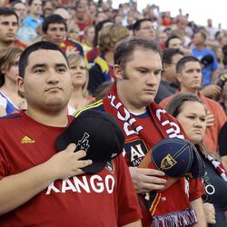 Real Salt Lake fans participate in a moment of silence for the victims of the Colorado shootings prior to their game against the Colorado Rapids at Rio Tinto Stadium in Sandy Saturday, July 21, 2012.