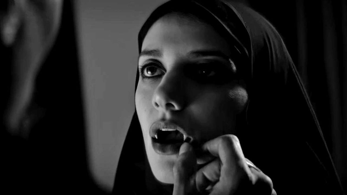 Sheila Water as the girl baring her fangs in A Girl Walks Home Alone At Night.