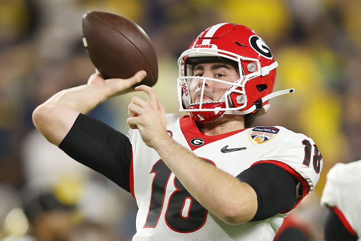 JT Daniels #18 of the Georgia Bulldogs warms up prior to the game against the Michigan Wolverines in the Capital One Orange Bowl for the College Football Playoff semifinal game at Hard Rock Stadium on December 31, 2021 in Miami Gardens, Florida.