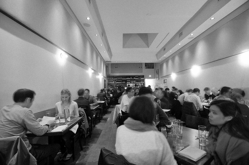 Diners sit inside Animal restaurant on Fairfax Avenue in March 2014. (Black and white)