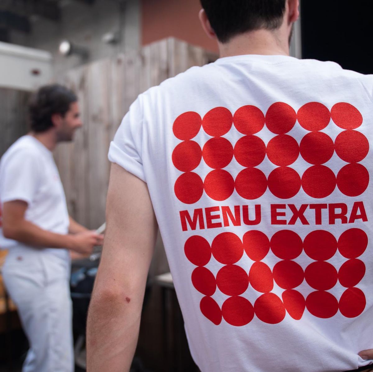 man wearing Menu Extra T-shirt