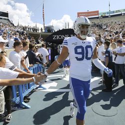 Brigham Young Cougars defensive lineman Devin Kaufusi (90) enters the field in Provo on Saturday, Sept. 21, 2019.