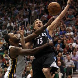 Mo Williams of the Utah Jazz fouls Luke Ridnour of the Minnesota Timberwolves during NBA basketball in Salt Lake City Friday, April 12, 2013.