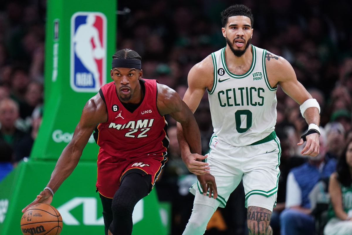 Miami Heat forward Jimmy Butler (22) dribbles against Boston Celtics forward Jayson Tatum (0) during the second half of game two of the Eastern Conference Finals for the 2023 NBA playoffs at TD Garden.