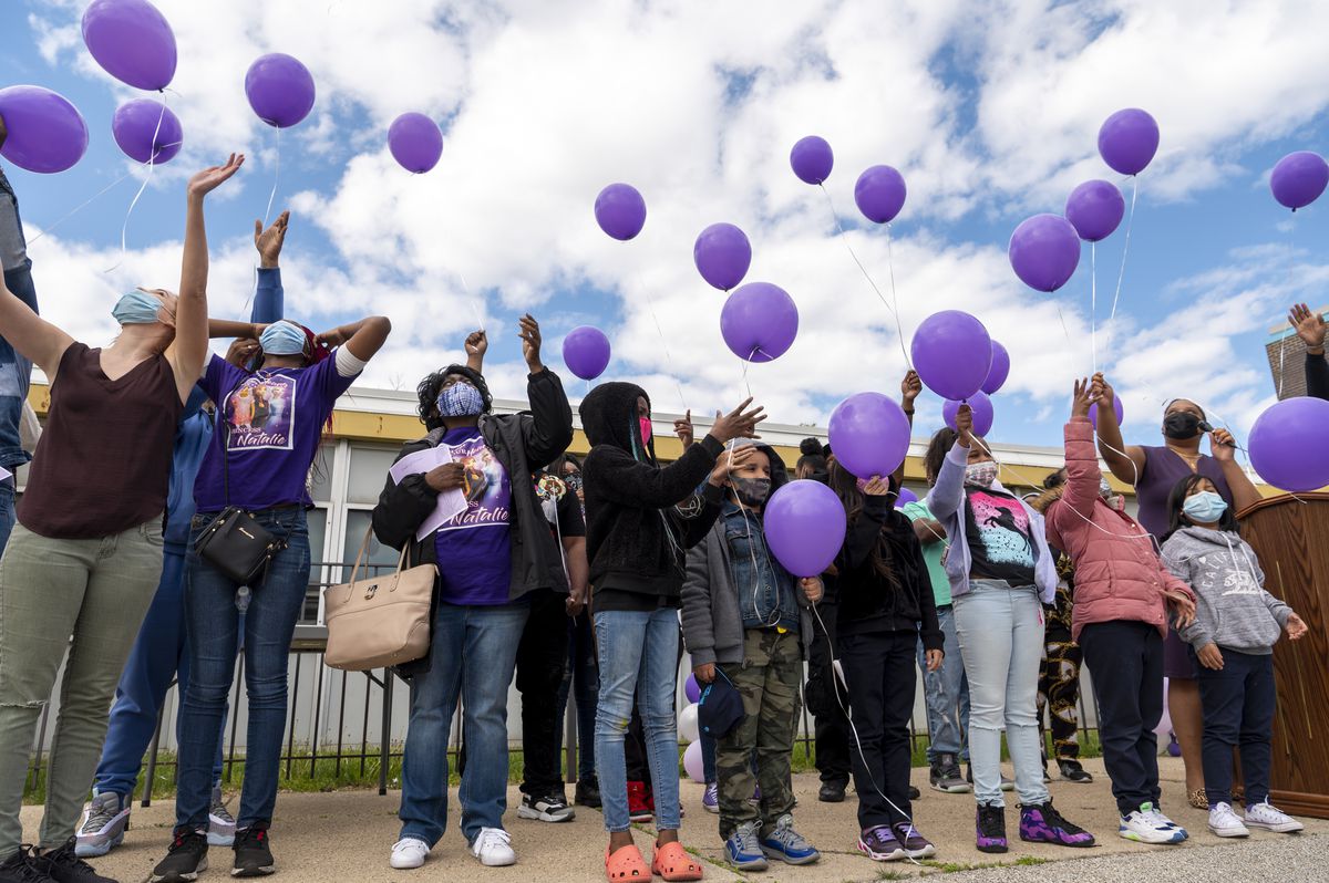 Students, family members and staff release balloons during a outdoor memorial for Natalia Wallace at Crown Community Academy of Fine Arts, Friday, May 7, 2020.
