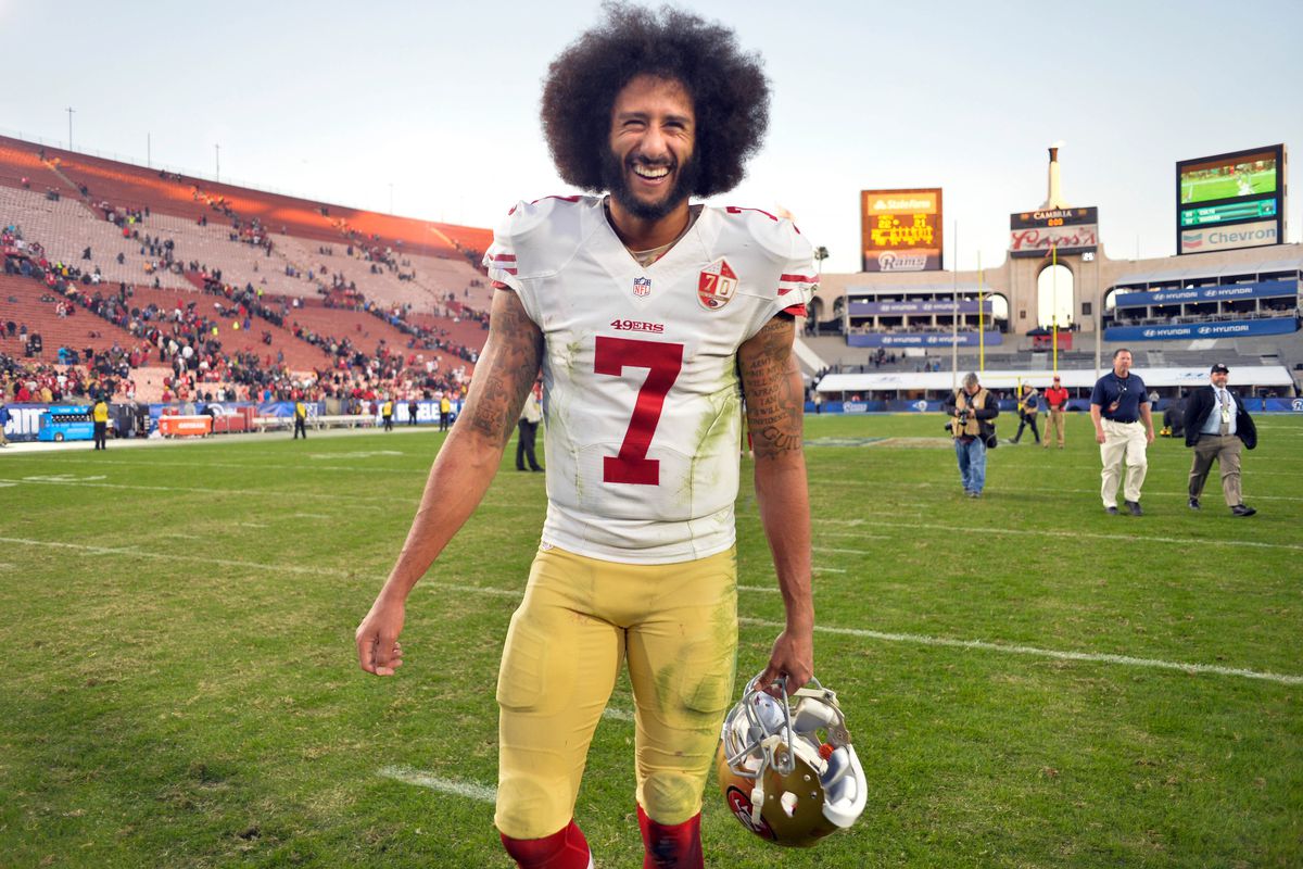 San Francisco 49ers quarterback Colin Kaepernick smiles after a 22-21 come-from-behind win over the Los Angeles Rams at Los Angeles Memorial Coliseum.