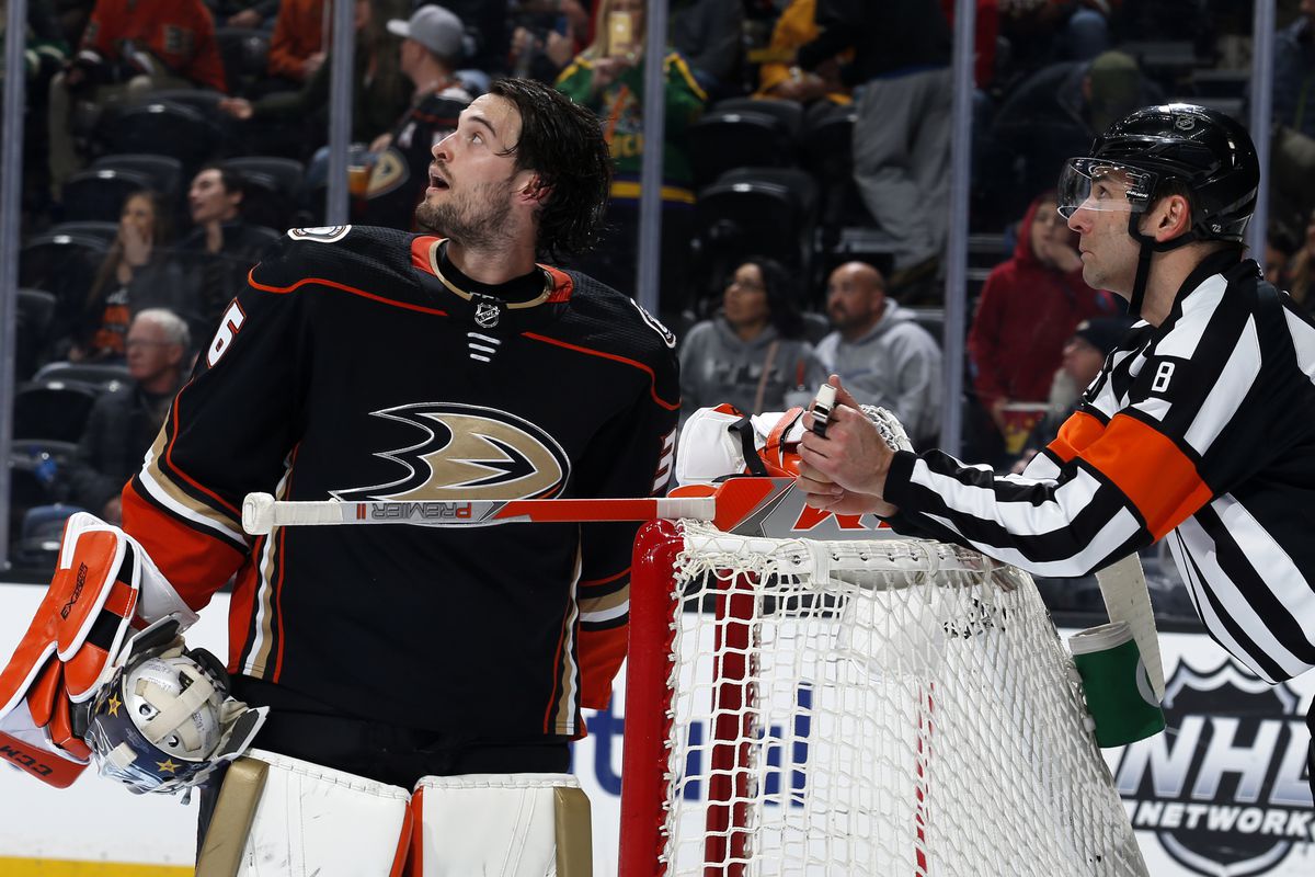 ANAHEIM, CA - FEBRUARY 23: John Gibson #36 of the Anaheim Ducks watches a replay with referee Dave Jackson #8 during the game against the Vegas Golden Knights at Honda Center on February 23, 2020 in Anaheim, California.