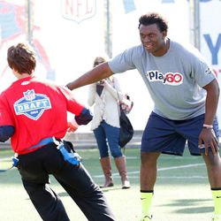 BYU's Ziggy Ansah participates in the NFL "Play 60" event for kids prior to the 2013 NFL draft.