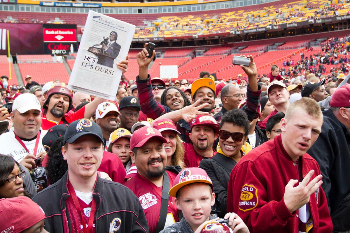 April 28, 2012; Landover, MD, USA; Washington Redskins fans react to the introduction of Robert Griffin III during the Redskins introduction of him at FedEx Field.  Mandatory Credit: Paul Frederiksen-US PRESSWIRE