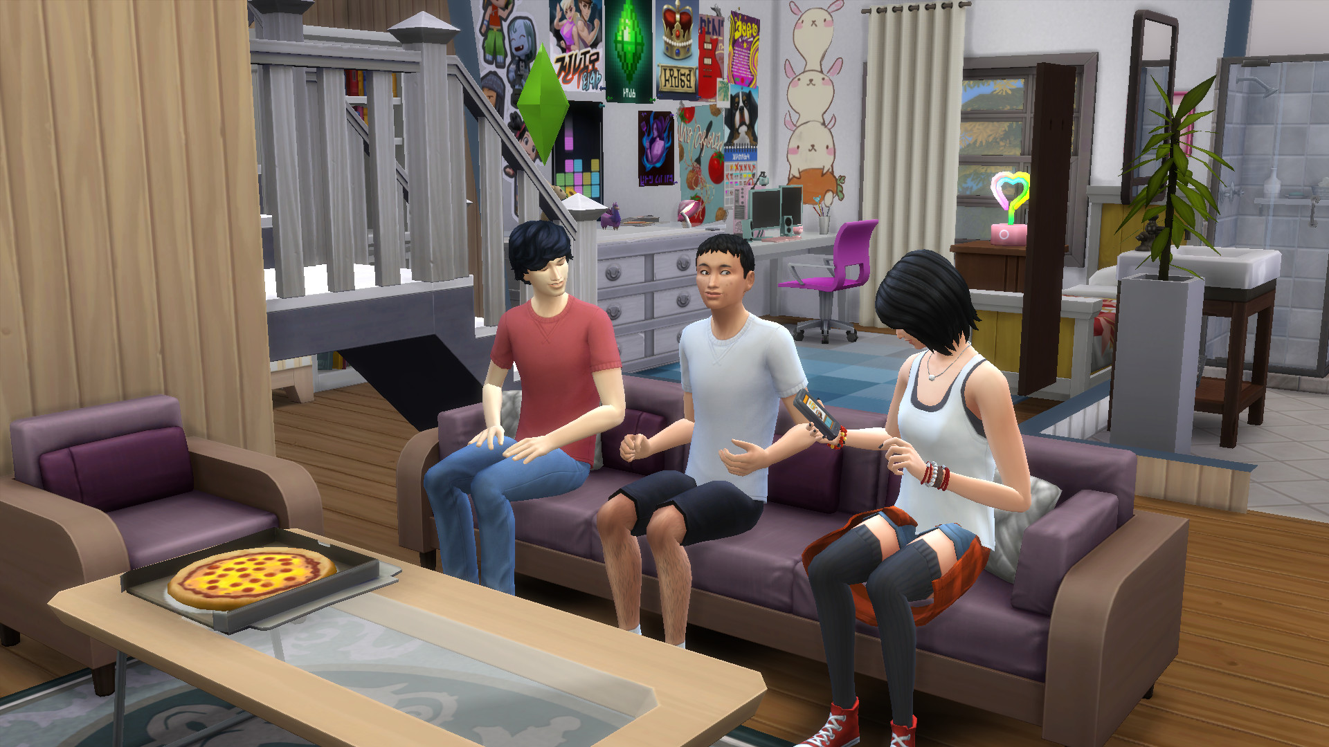 Three teen Sims sit on a sofa in front of a box of pizza, hanging out