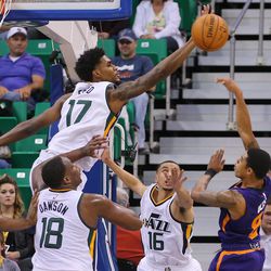 Utah Jazz guard Quincy Ford (17) misses a block on a shot attempt by Phoenix Suns guard Tyler Ulis (8) as the Jazz and Suns play in Salt Lake City at Vivint Smart home arena on Wednesday, Oct. 12, 2016.
