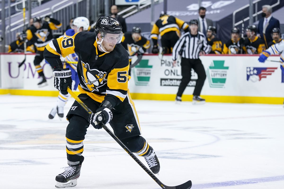 Pittsburgh Penguins Left Wing Jake Guentzel (59) skates with the puck during the third period in the NHL game between the Pittsburgh Penguins and the Buffalo Sabres on May 8, 2021, at PPG Paints Arena in Pittsburgh, PA.