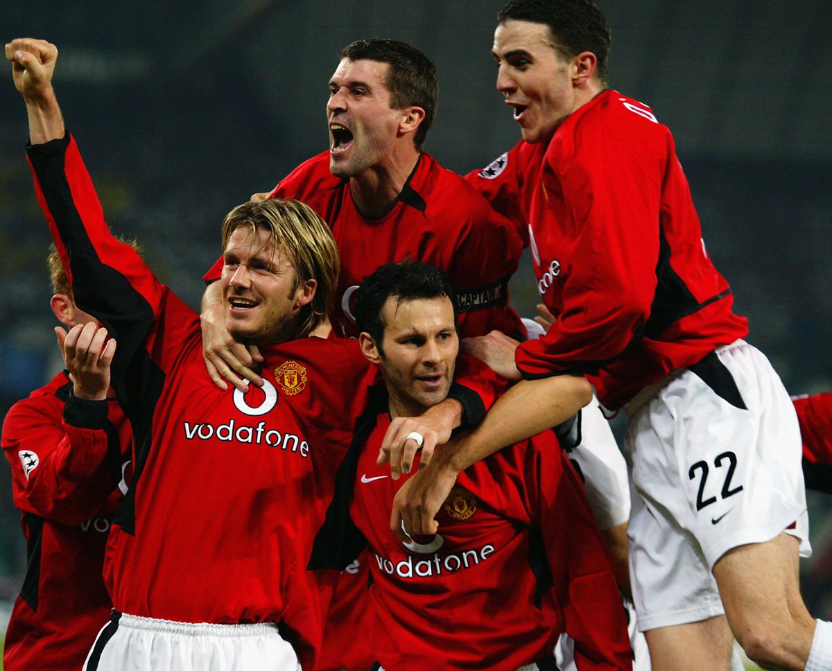 Manchester United players David Beckham, Roy Keane and John O’Shea celebrate team-mate Ryan Giggs superb second goal
