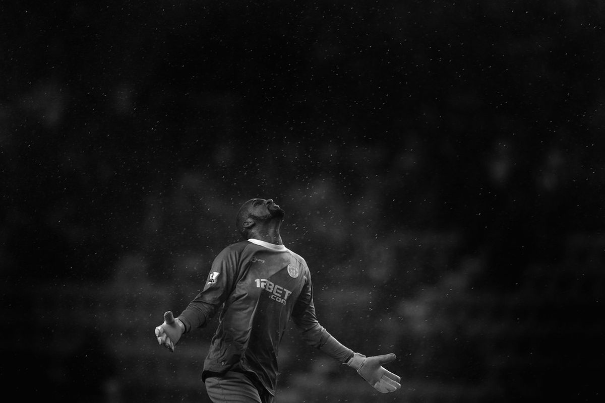  Wigan goalkeeper Ali Al-Habsi looks upto the heavens as rain pours down during the Barclays Premier League match between Wigan Athletic and Sunderland at the DW Stadium.