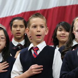Children from the school choir sing "The Star Spangled Banner" as they join GOP presidential candidate and Texas Sen. Ted Cruz, former candidate Carly Fiornia, talk show host Glenn Beck and Sen. Mike Lee, R-Utah, at a rally in Draper at the American Preparatory Academy Saturday, March 19, 2016.