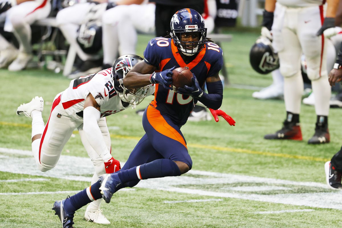 Jerry Jeudy #10 of the Denver Broncos makes a reception against Kendall Sheffield #20 of the Atlanta Falcons during the fourth quarter at Mercedes-Benz Stadium on November 08, 2020 in Atlanta, Georgia.