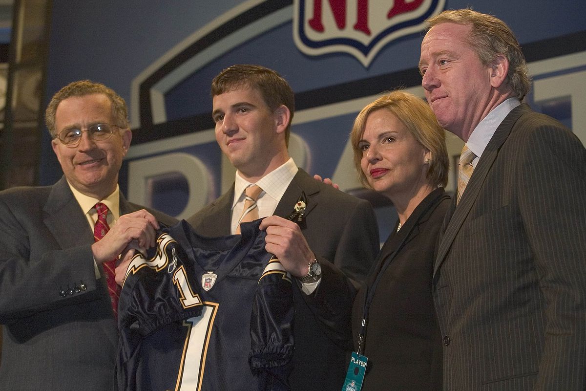Eli Manning with his family and commissioner Paul Tagliabue during the 2004 NFL draft. (Getty Images)