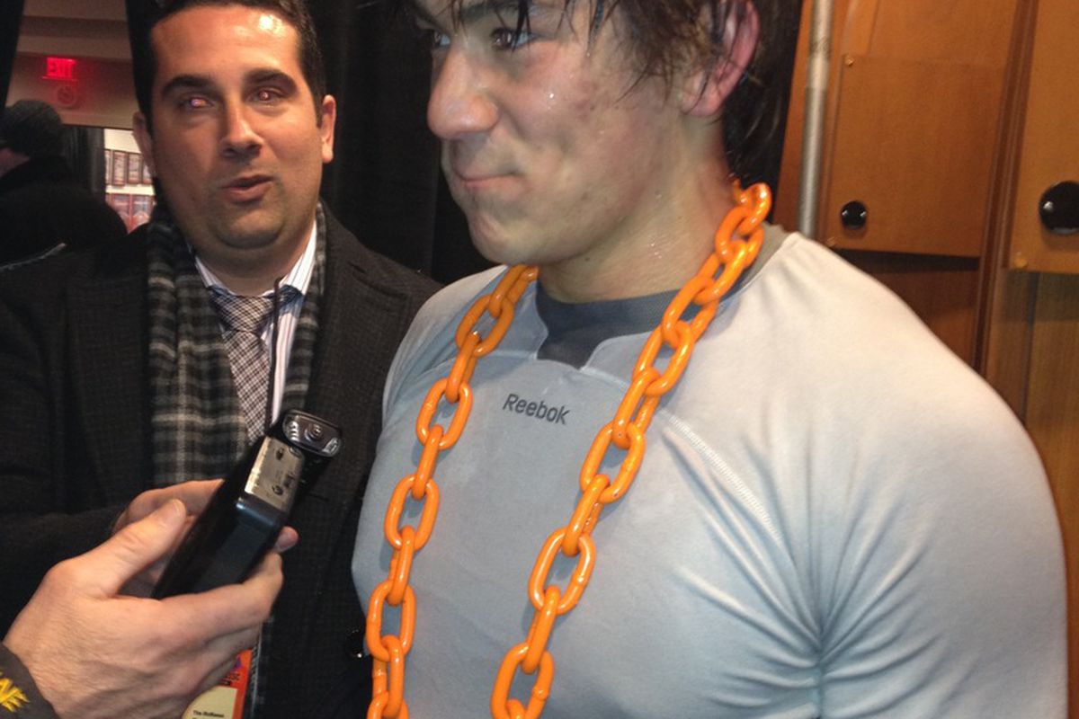 The Phantoms give out an orange chain to the player of the game. Here, Shane Harper, overtime hero. 