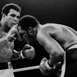 FILE - In this Oct. 1, 1975, file photo, Muhammad Ali's throws a right at Joe Frazier in the 13th round in their title bout in Manila, Philippines. Ali, the magnificent heavyweight champion whose fast fists and irrepressible personality transcended sports and captivated the world, has died according to a statement released by his family Friday, June 3, 2016. He was 74. 