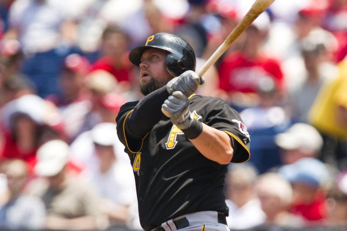 Jun 28, 2012; Philadelphia, PA, USA; Pittsburgh Pirates first baseman Casey McGehee (14) hits a three run home run during the first inning against the Philadelphia Phillies at Citizens Bank Park. Mandatory Credit: Howard Smith-US PRESSWIRE