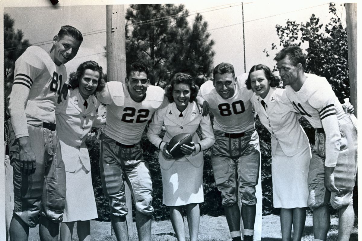 Football Players With Women in Uniforms