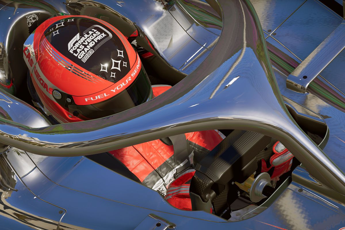 Close-up of a driver cockpit, overhead, in F1 23, showing the driver’s helmet and the protective halo around the cockpit.
