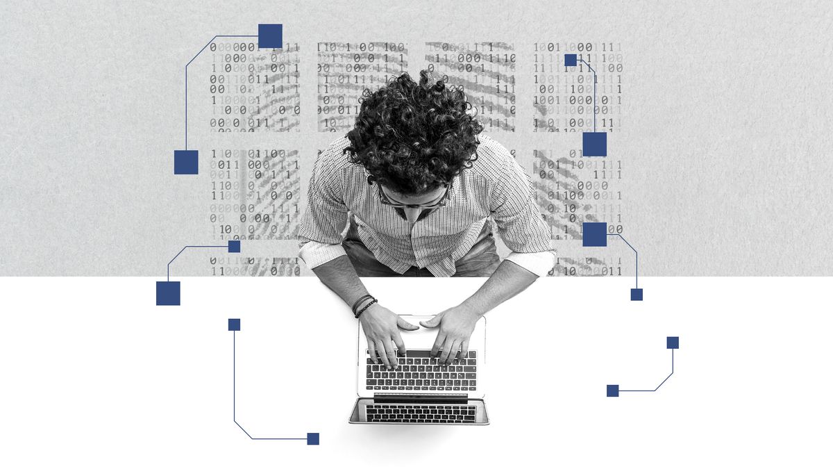 An overhead view of a man on a laptop. There’s binary code in the background.