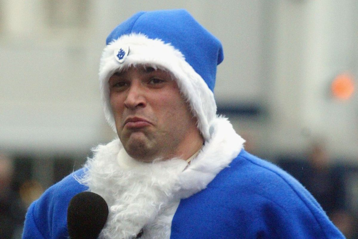He's dressed as Santa, he's wearing blue. Mission accomplished.