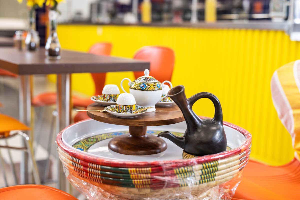 An Ethiopian coffee service is laid out on a table.