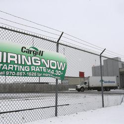 In this Jan. 8, 2016 photo, a sign advertises job openings at the meat processing plant owned and run by Cargill Meat Solutions, in Fort Morgan, a conservative rural community on the eastern plains of Colorado. Many of Fort Morgan's roughly 1,200 Somali immigrants, many who are refugees who fled war, work at Cargill. 