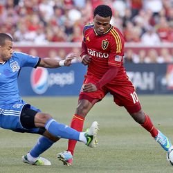 San Jose's Jason Hernandez slides in to try to block RSL's Robbie Findley in an MLS game between Real Salt Lake and San Jose at Rio Tinto Stadium in Sandy on Saturday, June 1, 2013. RSL beat the Earthquakes 3-0.