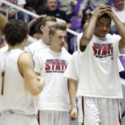 Logan players show their disappointment after they lost to Kearns in the 4A boys basketball quarterfinals at the Dee Events Center in Ogden Thursday, Feb. 26, 2015.