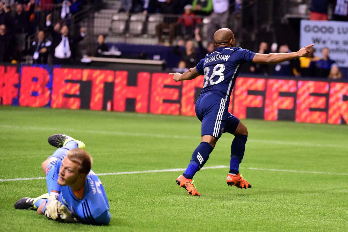 Robert Earnshaw (right) split the defense and headed in the final goal of the Whitecaps' 3-0 domination of the Dynamo.