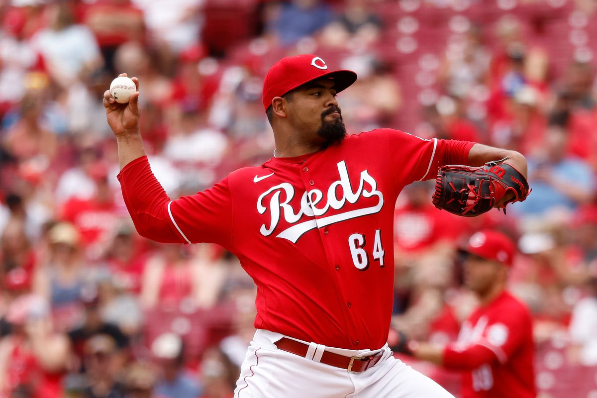 Tony Santillan #64 of the Cincinnati Reds pitches during the game against the Colorado Rockies at Great American Ball Park on June 13, 2021 in Cincinnati, Ohio.