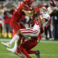 Utah Utes defensive back Chase Hansen (22) hammers Indiana Hoosiers wide receiver Nick Westbrook (15) as the Utes and the Hoosiers play in the Foster Farms Bowl in Santa Clara, California, on Wednesday, Dec. 28, 2016.