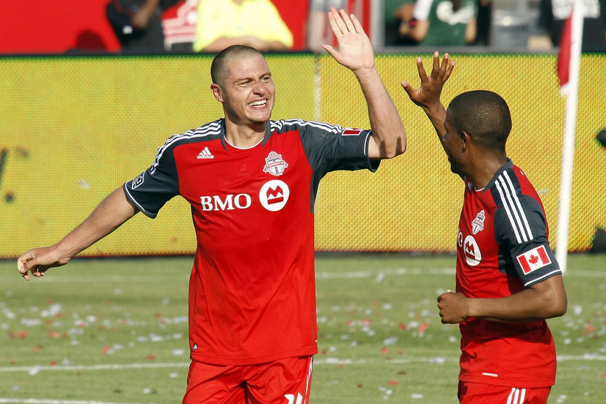 TORONTO, CANADA - MAY 26: Danny Koevermans #14 and Jeremy Hall #25 of Toronto FC celebrate Koevermans' goal against the Philadelphia Union during MLS action at BMO Field May 26, 2012 in Toronto, Ontario, Canada.  (Photo by Abelimages/Getty Images)