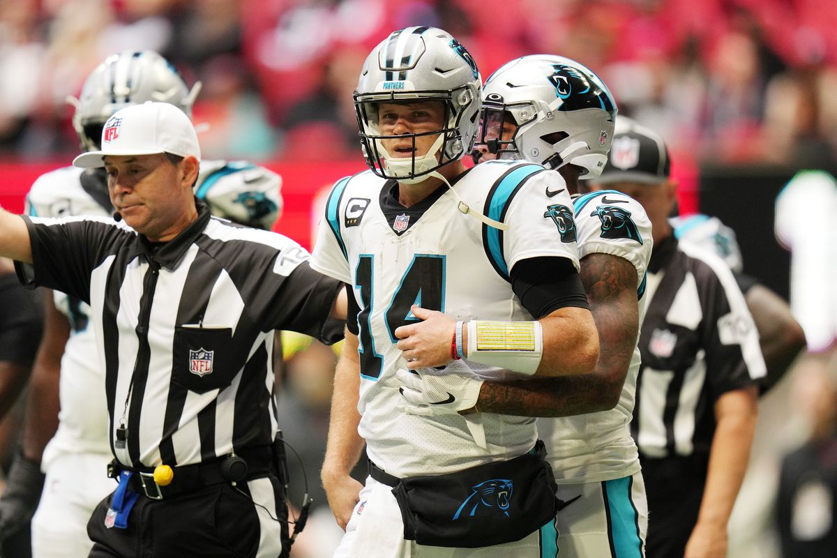 Sam Darnold #14 of the Carolina Panthers walks across the field in the fourth quarter against the Atlanta Falcons at Mercedes-Benz Stadium on October 31, 2021 in Atlanta, Georgia.