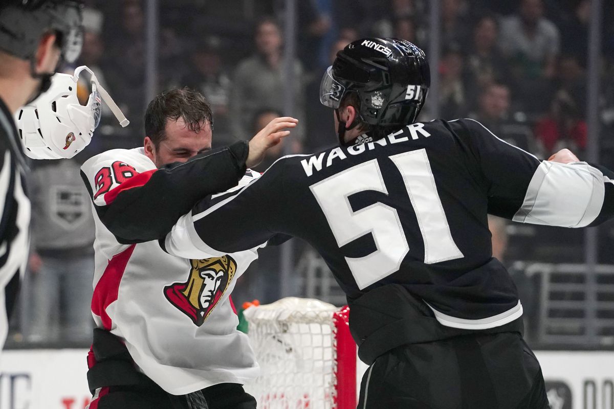 Mar 11, 2020; Los Angeles, California, USA; Ottawa Senators center Colin White (36) and Los Angeles Kings left wing Austin Wagner (51) fight in the first period at Staples Center.