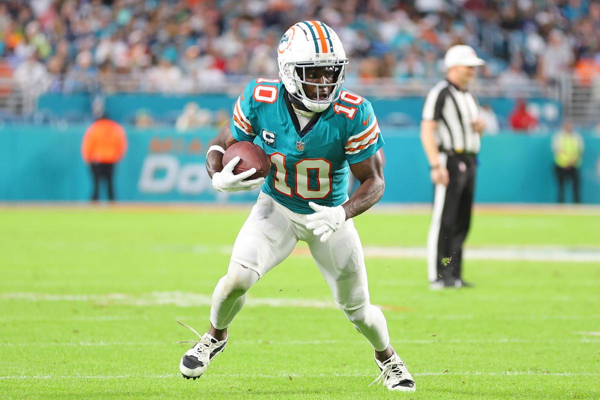 Tyreek Hill #10 of the Miami Dolphins runs for yards during a game against the Dallas Cowboys at Hard Rock Stadium on December 24, 2023 in Miami Gardens, Florida. The Dolphins defeated the Cowboys 22-20.