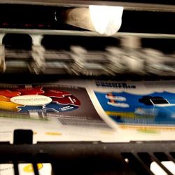 A test sheet is printed on the Heidelberg Speedmaster XL 106 printing press at KP Corporation in Salt Lake City on Wednesday, June 19, 2013.