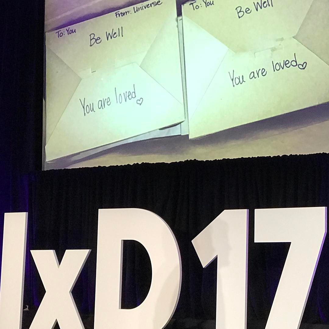 Image showing Interaction 17 signage and handwritten notes reading “be well” and “you are loved.”