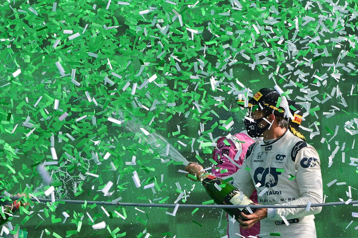 Winner AlphaTauri’s French driver Pierre Gasly sprays champagne under confetti rain on the podium after the Italian Formula One Grand Prix at the Autodromo Nazionale circuit in Monza on September 6, 2020.