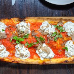 <a href="http://www.eater.com/2014/9/3/6162521/toronto-musts-actinolite-scaramouche-buca">Buca in Toronto: truffled burratta pizza.</a>