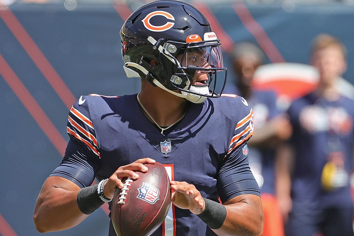 Justin Fields #1 of the Chicago Bears looks for a receiver during a preseason game against the Miami Dolphins at Soldier Field on August 14, 2021 in Chicago, Illinois. The Bears defeated the Dolphins 20-13.