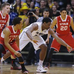 Colorado forward Tory Miller, third from left, pursues a loose ball as Utah forward Jakob Poelti, far left, guard Brandon Taylor, second from left, and forward Chris Reyes, right, cover in the first half of an NCAA college basketball game Saturday, Feb. 7, 2015., in Boulder, Colo. (AP Photo/David Zalubowski)